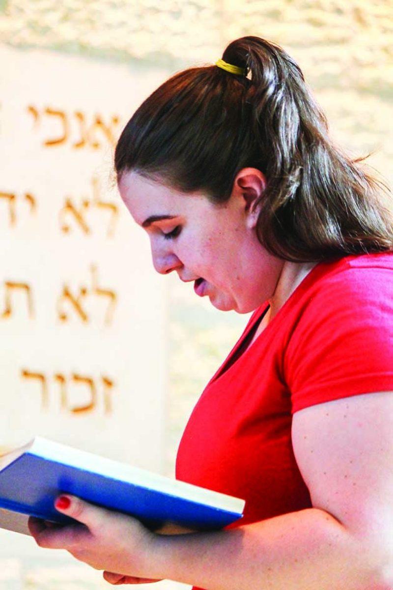 Photo by Jeff DundasJackie Mitchell reads scripture while rehearsing in the A&M Hillel Center on Monday. 