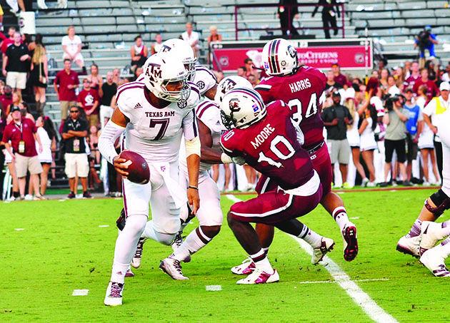 Photo provided
In the first game of the season, sophomore quarterback Kenny Hill sets a new school record with 511 passing yards.