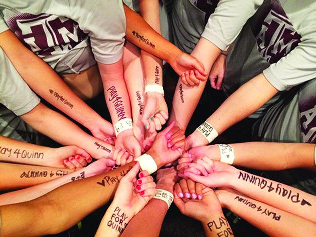 Provided
The Aggie soccer team marks “Play 4 Quinn” on their arms before matches.