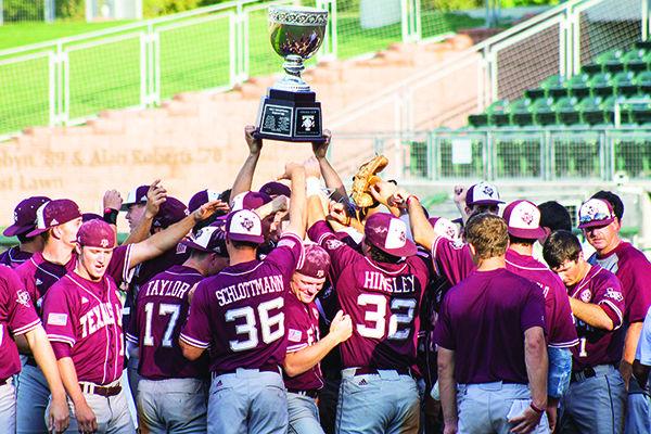 The Farmers hoist the Omaha Cup on Wednesday after defeating the Plowboys in the intrasquad Maroon and White Championship Series. Sarah Lane — THE BATTALION.