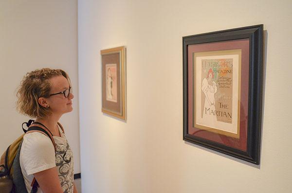 Photo by Jonathan Sheen
Engineering freshman Bre Steele views the Art Nouveau exhibit at the J. Wayne Stark Galleries in the MSC.
 