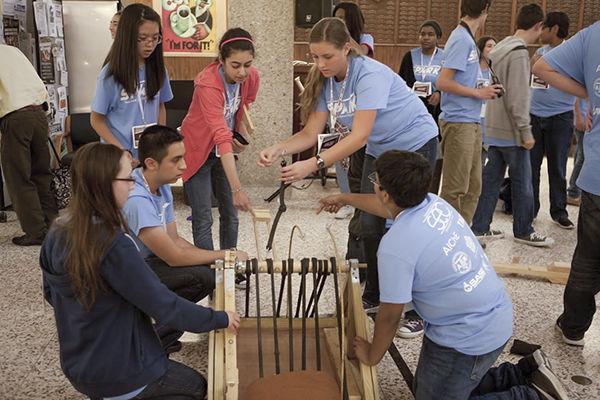 Photo by Vanessa Pena
High school students prepare their catapult for a design competition this Saturday at Texas A&M. 