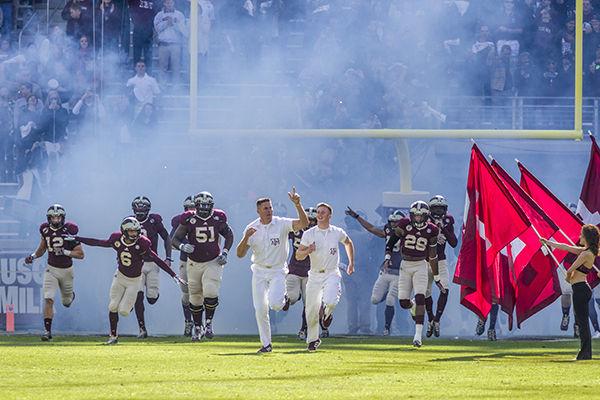Bryan Johnson -- THE BATTALION
Yell leaders lead the football team onto the field before the A&M vs. University of Louisiana-Monroe game. 