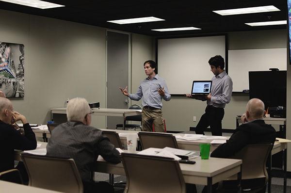 Finance seniors Ryan Cash and Donnie Walker pitch their business model in hopes to seek guidance from established entrepreneurs. 
Photo by Nikita Redkar.