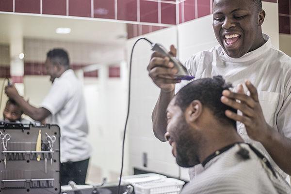 Photos by Tanner Garza — THE BATTALION
Agricultural economics sophomore Osagie Aisueni serves as the team barber for A&M men’s basketball, providing haircuts to players like senior Antwan Space.