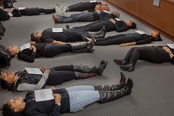 Members of the Black Law Student Association stage a die-in Monday.
PROVIDED