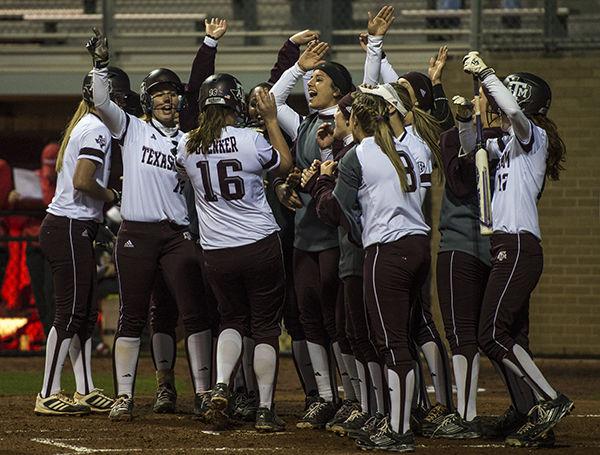 Tanner Garza — THE BATTALIONAggies celebrate after sophomore Regan Boenker hit a triple early in the game against Houston Wednesday night.  