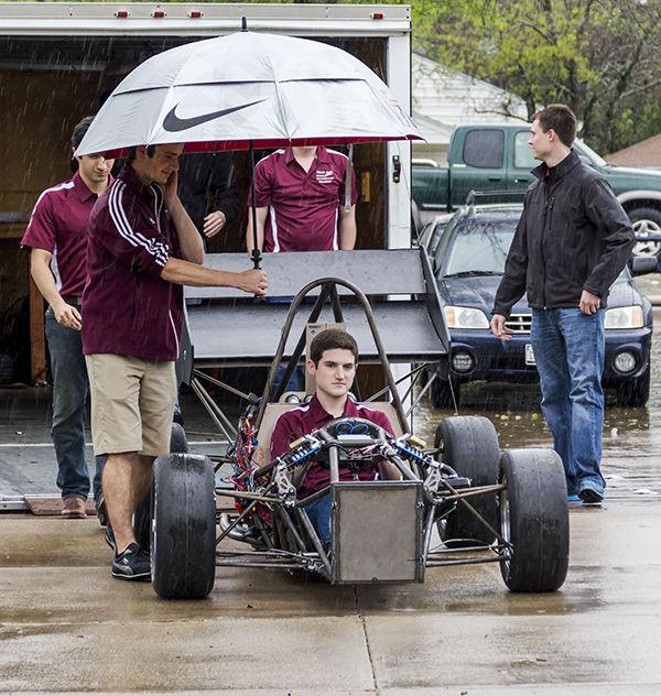 Mechanical engineering senior Andrew Nelson demos the race car Saturday built by 21 A&M students with a budget of $52,000.