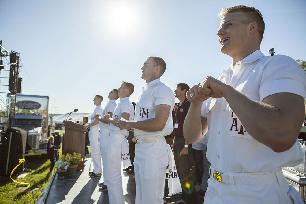 The newly elected yell leaders for the 2015-2016 school year lead yells at The Big Event's opening ceremony on Saturday.