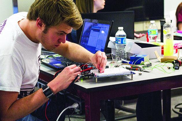 Tim Lai — THE BATTALION
Nuclear engineer junior James Bunsen works on his invention at Aggies Invent. 