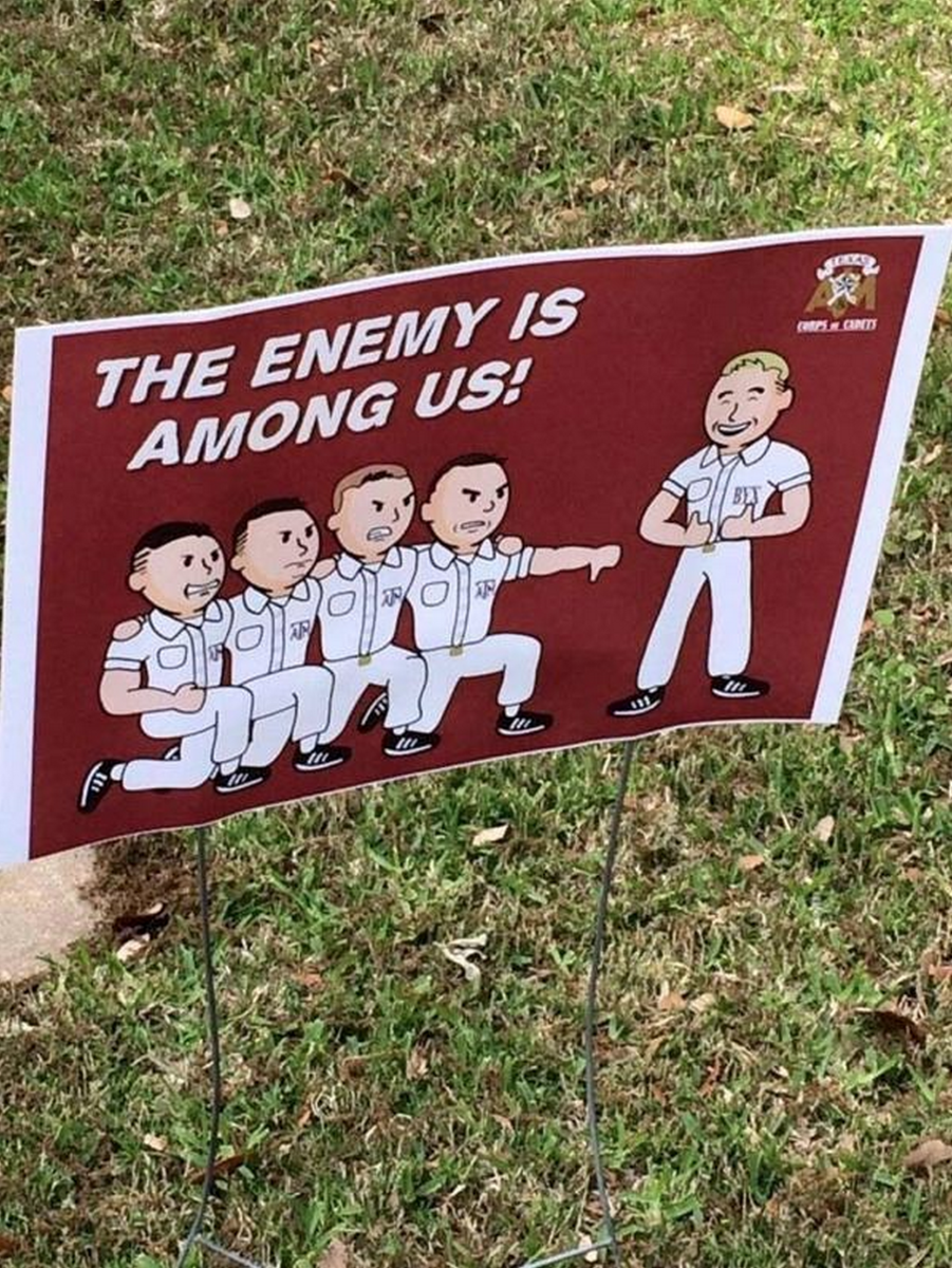Signs posted around campus Thursday depict negative images of fraternities and non-cadet yell leaders.