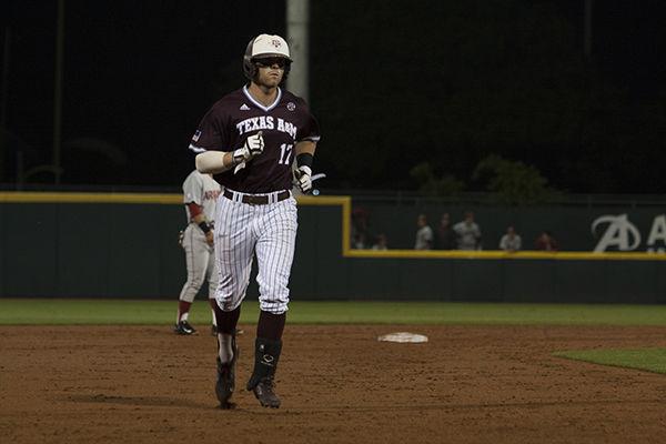 <p>Logan Taylor rounding the bases after hitting a homer into left field.</p>