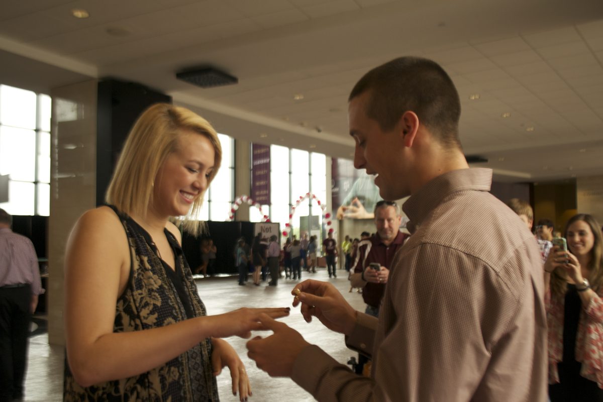 Former+Aggie+student+presents+his+sister+with+her+ring.