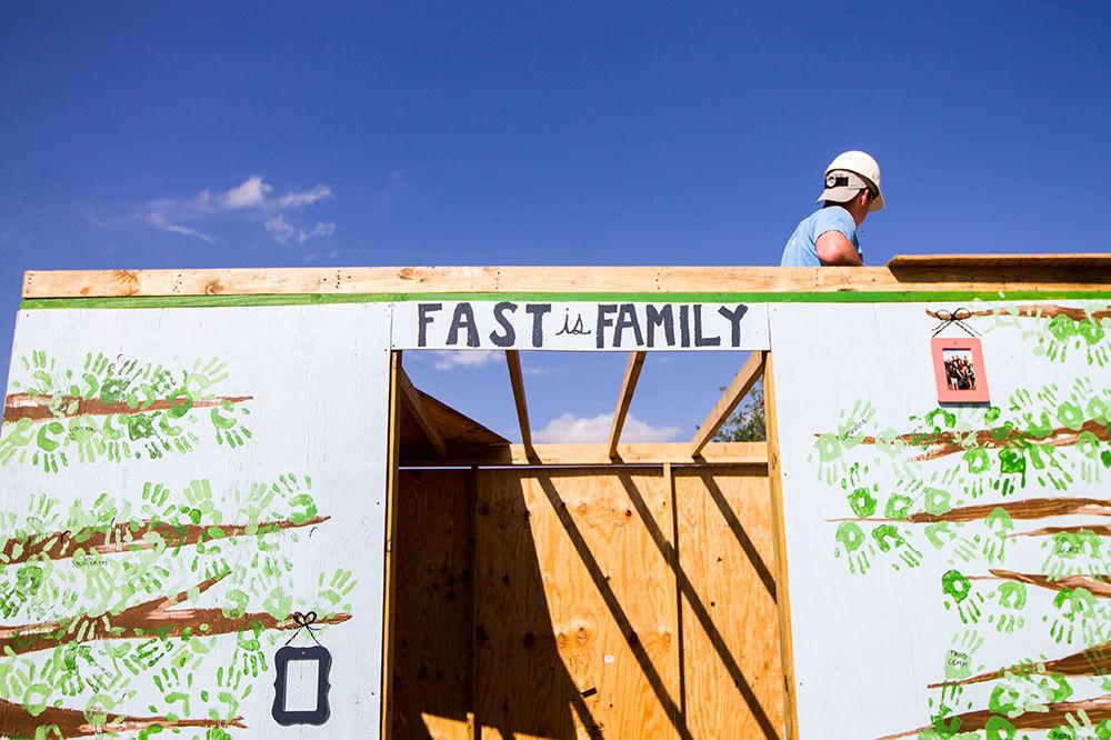 Matthew Barkis, accounting junior, puts together the roof on the Freshman Aggies Spreading Tradition shack, FAST is Family.