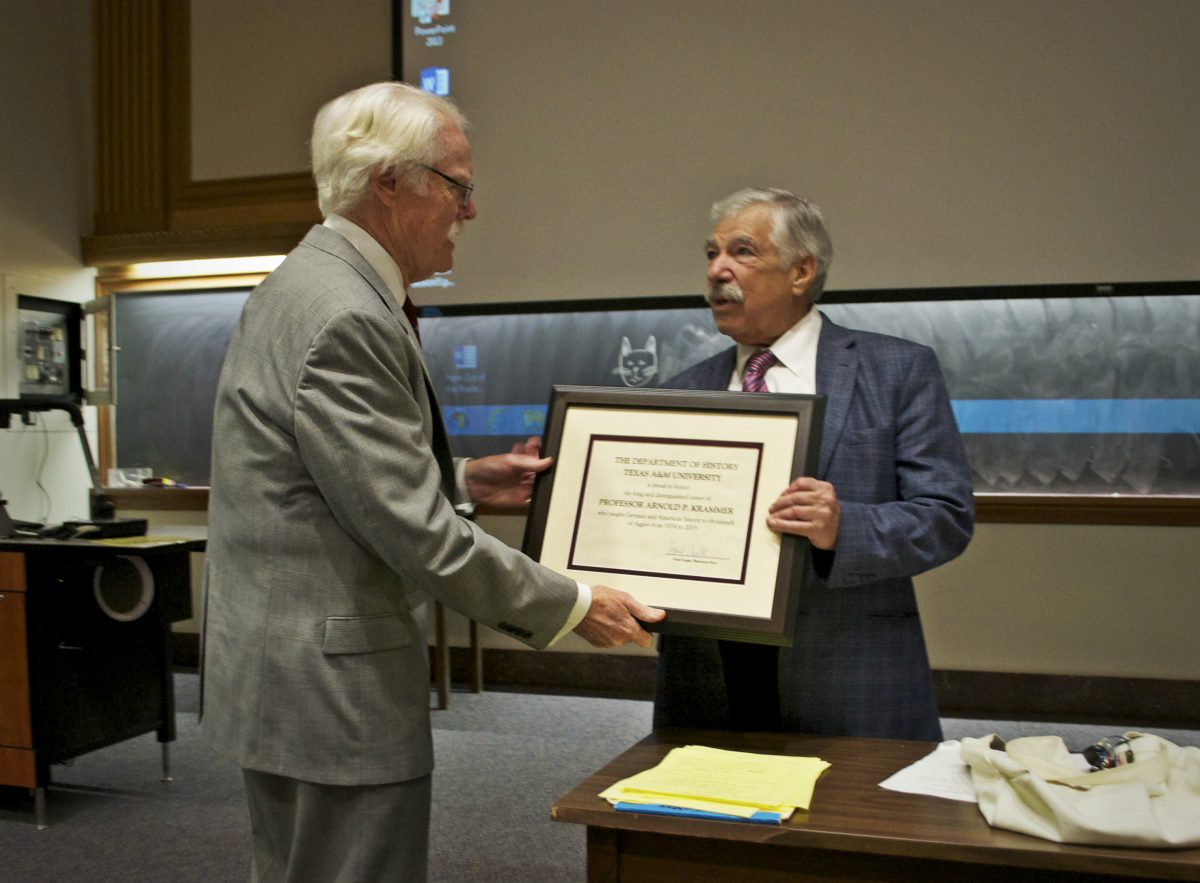 Dr. Krammer receives award from long-time colleague Dr. RJQ Adams.