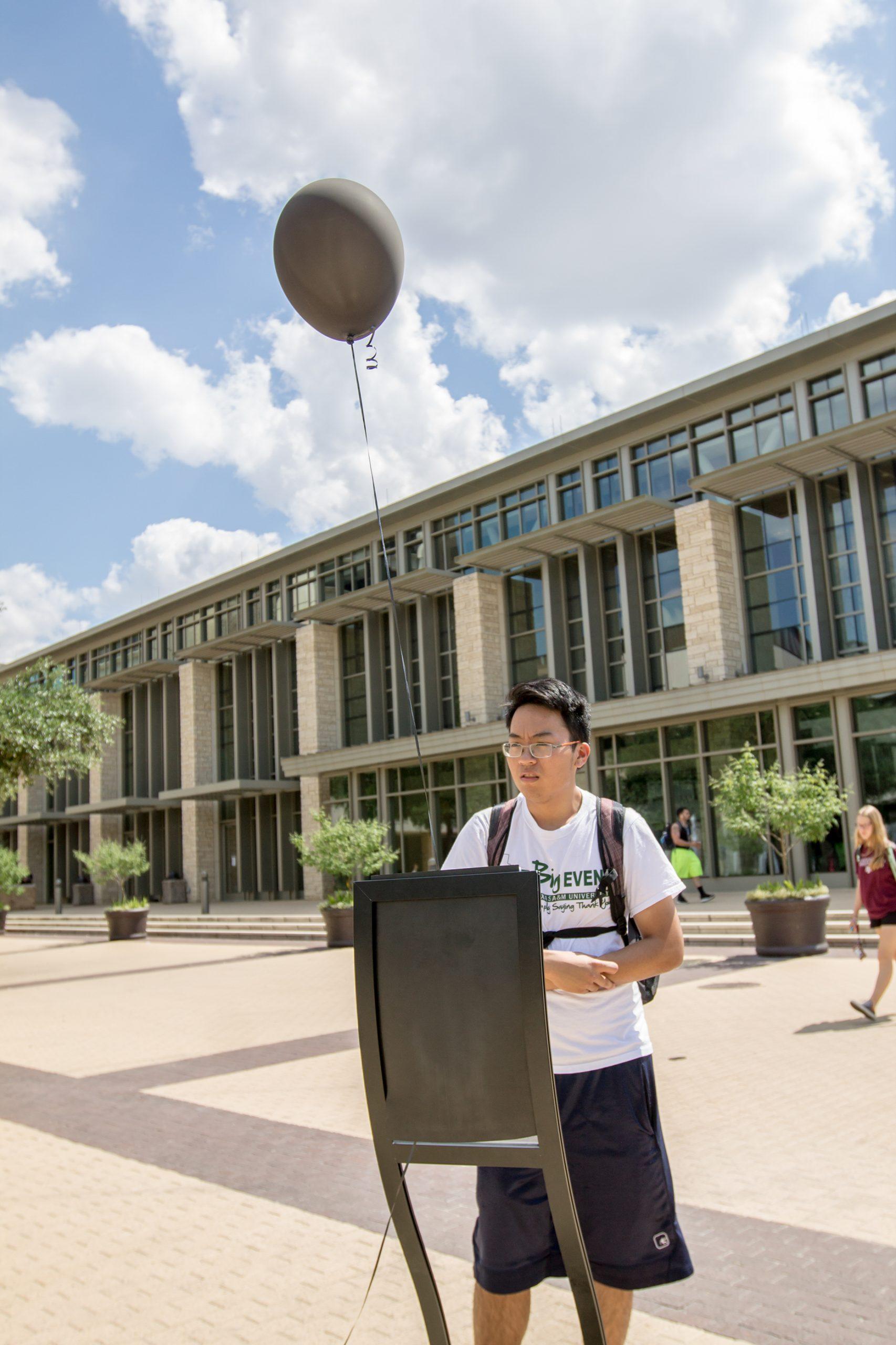 Black balloons meant to stir conversation on police violence