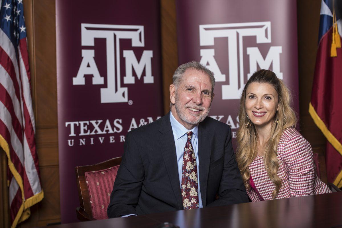 President Michael Young and his wife, Marti Young, speak with The Battalion reporters during his first official day at A&M Friday.