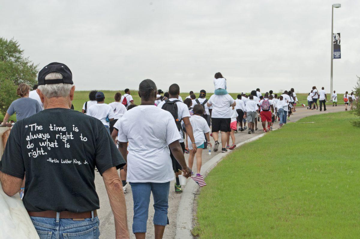 Rain or shine, the time is always right to do what is right.  The cloudy weather and slight drizzle didnt bring the spirit of the Freedom Walkers down!