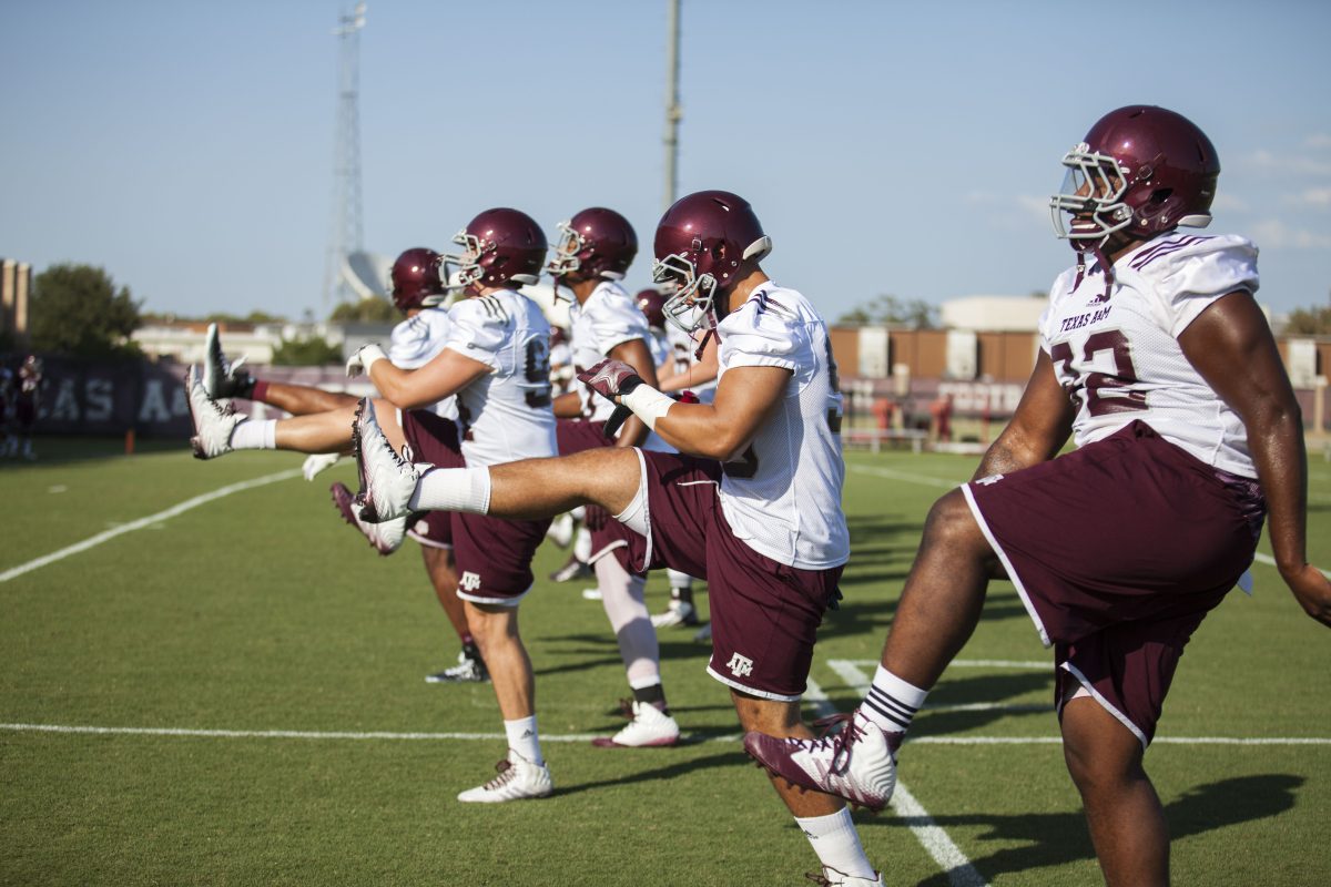 Players warm up before their first practice on Monday evening.