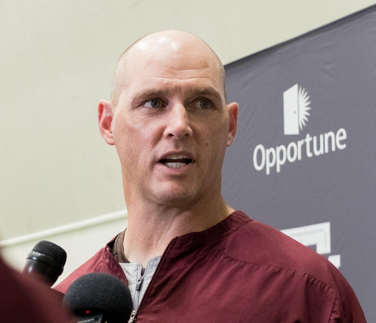 <p>Mark Hagen answers questions after Tuesday's football practice. </p>