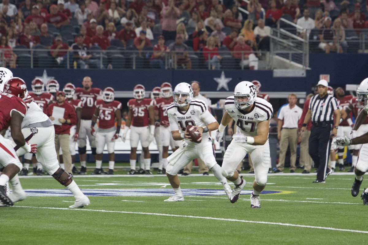 Quarterback Kyle Allen and tight end Caden Smith running a play during the TAMU v. Arkansas game on Saturday night.