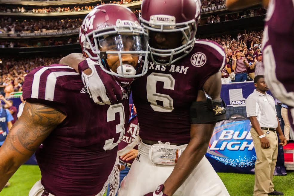 Kirk celebrates with Donovan Wilson after scoring a 66 yard touchdown.&#160;