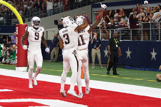 Junior receiver Josh Reynolds celebrates with teammate Christian Kirk after game-tying two-point conversion.