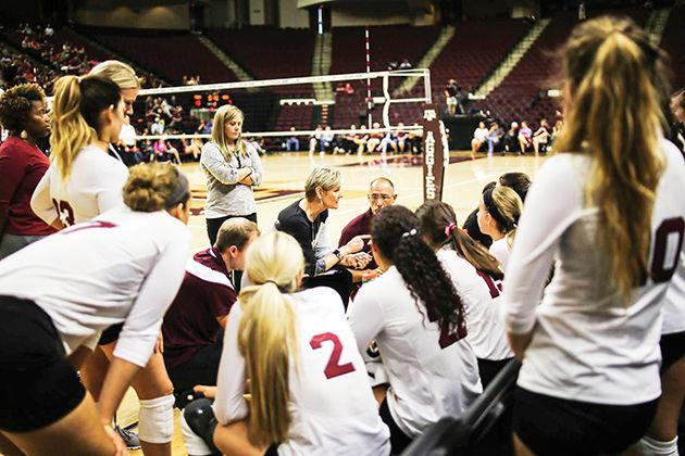 Head coach Laurie Corbelli&#160;brings the team in during a match.