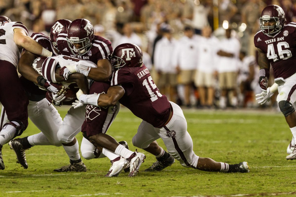 <p>Sophomore defensive end Myles Garrett makes a stop in the 30-17 win over Mississippi State.</p>