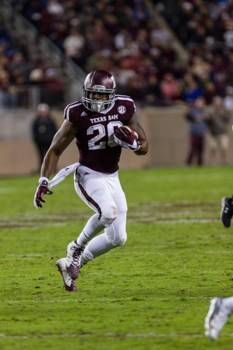 Sophomore running back James White moves the ball  upfield during Texas A&Ms Saturday matchup against Auburn.