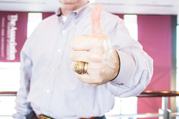 Marty Holmes, Class of 1987, wears his Aggie Ring and his wedding ring on the same finger.