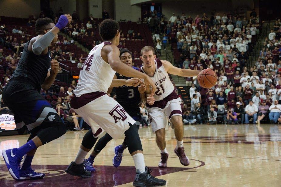 <p>Senior <strong>Alex Caruso</strong> works his way around a Kansas State player to move the ball down to the court. </p>