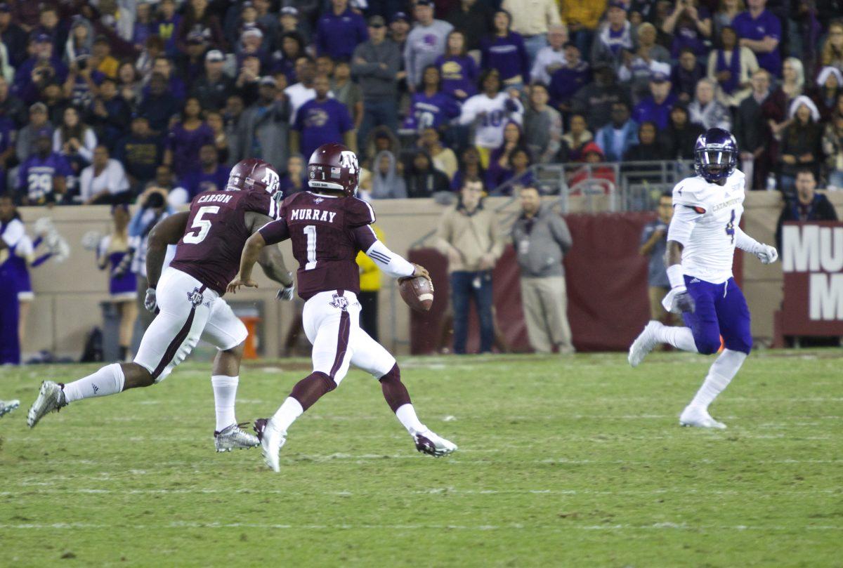 Kyler Murray on the run with the ball. 