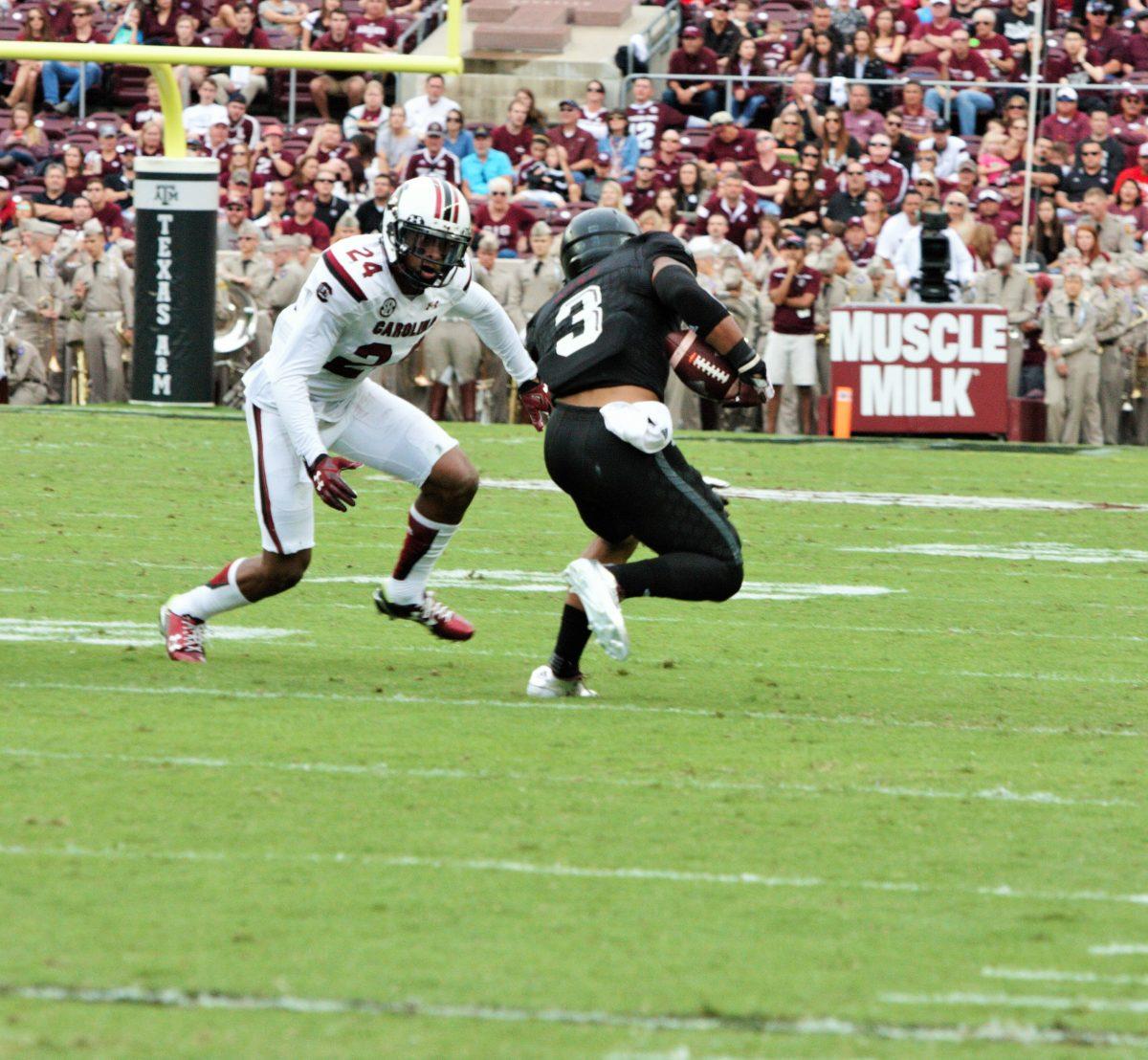 Freshman wide receiver Christian Kirk attempts to get past South Carolina safety D.J. Smith.