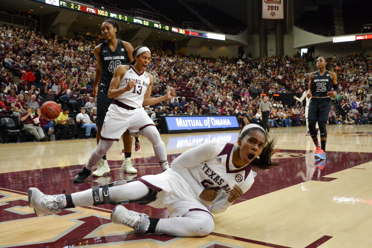 Jordan Jones celebrates after making a very difficult shot despite a hard foul.