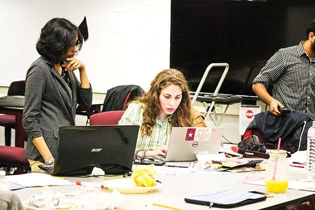 (Left to right) Ghada Zakaria and Anusree Saseendran grapple with STEM challenge at Aggies Invent.