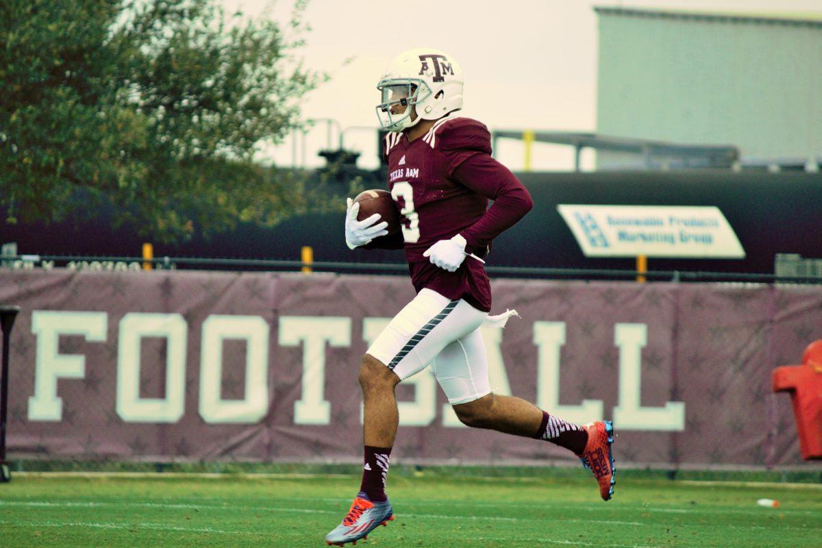 <p>Wide receiver Christian Kirk returns a punt during practice.</p>