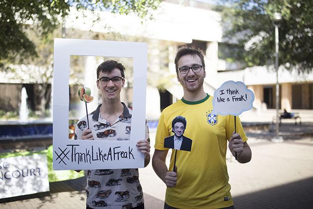 Luke Bacon (left), junior biomedical science major, and Mike Duncan, sophomore business honors and finance major, work to advertise for the upcoming Freakonomics event.