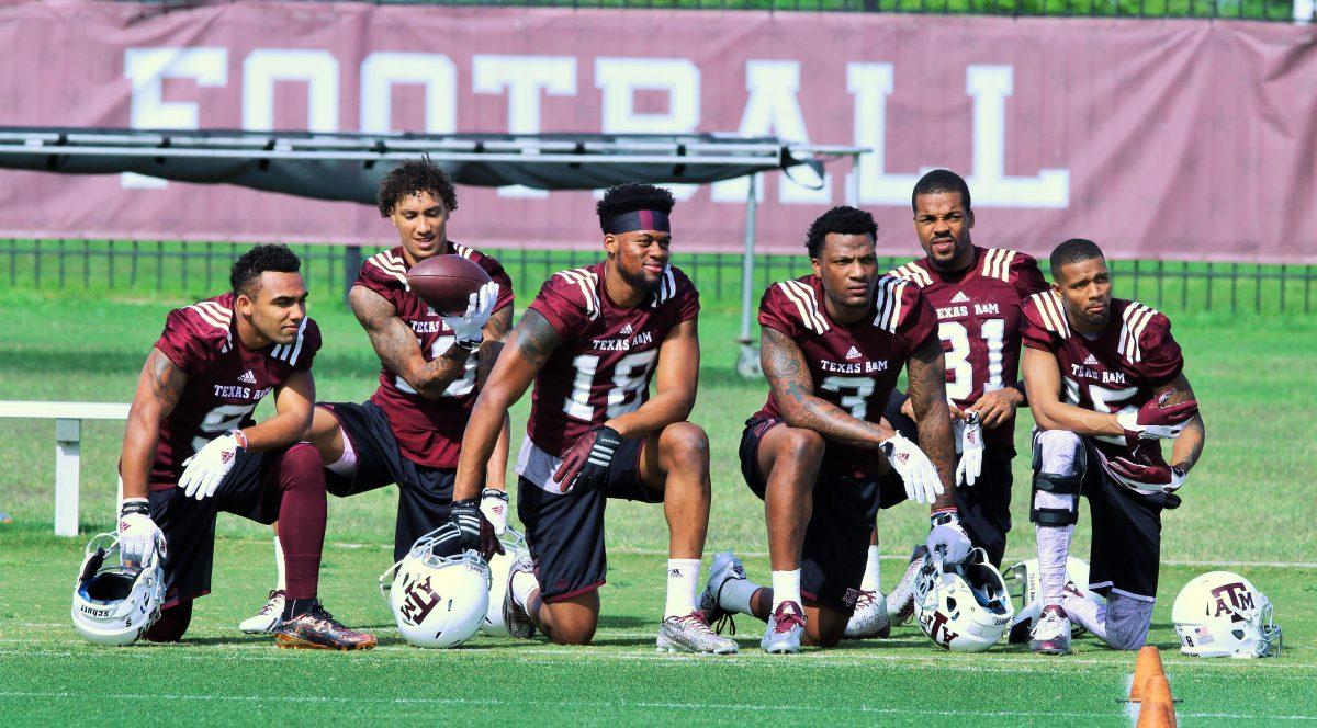 <p>The wide receiver crew waits on the sidelines to take part in a drill.</p>