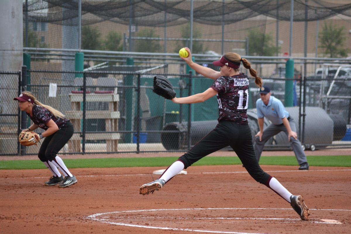 Sophomore Trinity Harrington winds up to pitch.