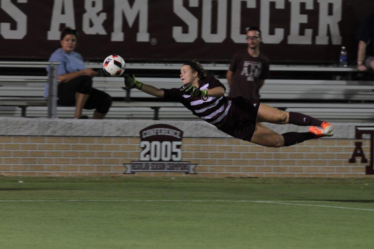 Senior goal keeper Danielle Rice makes daring leap in an attempt to block a high flying ball