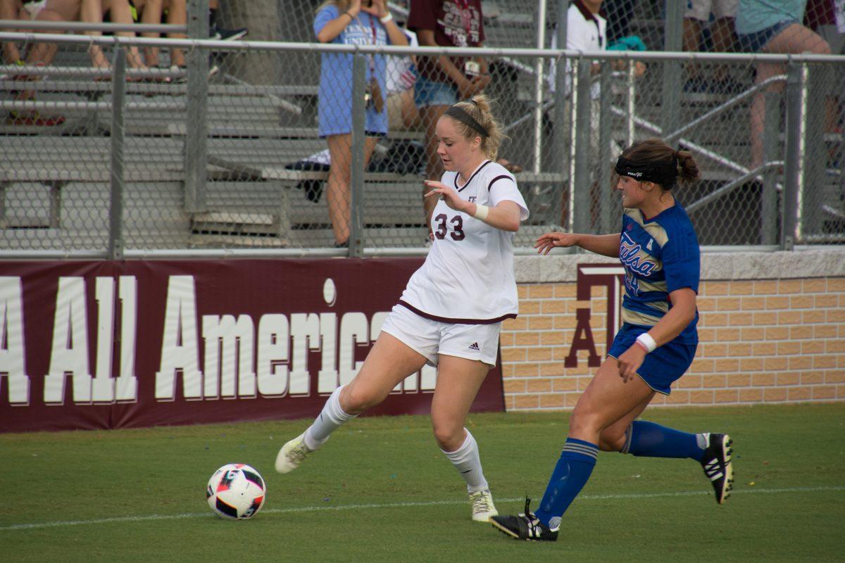 Sophomore Margaret Schmidt passes the ball to a teammate.