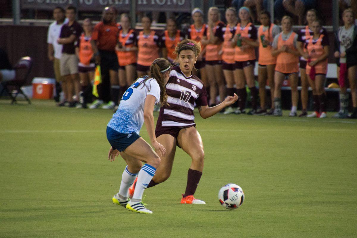 Freshmen Cienna Arrieta makes a move to pass by the defender.