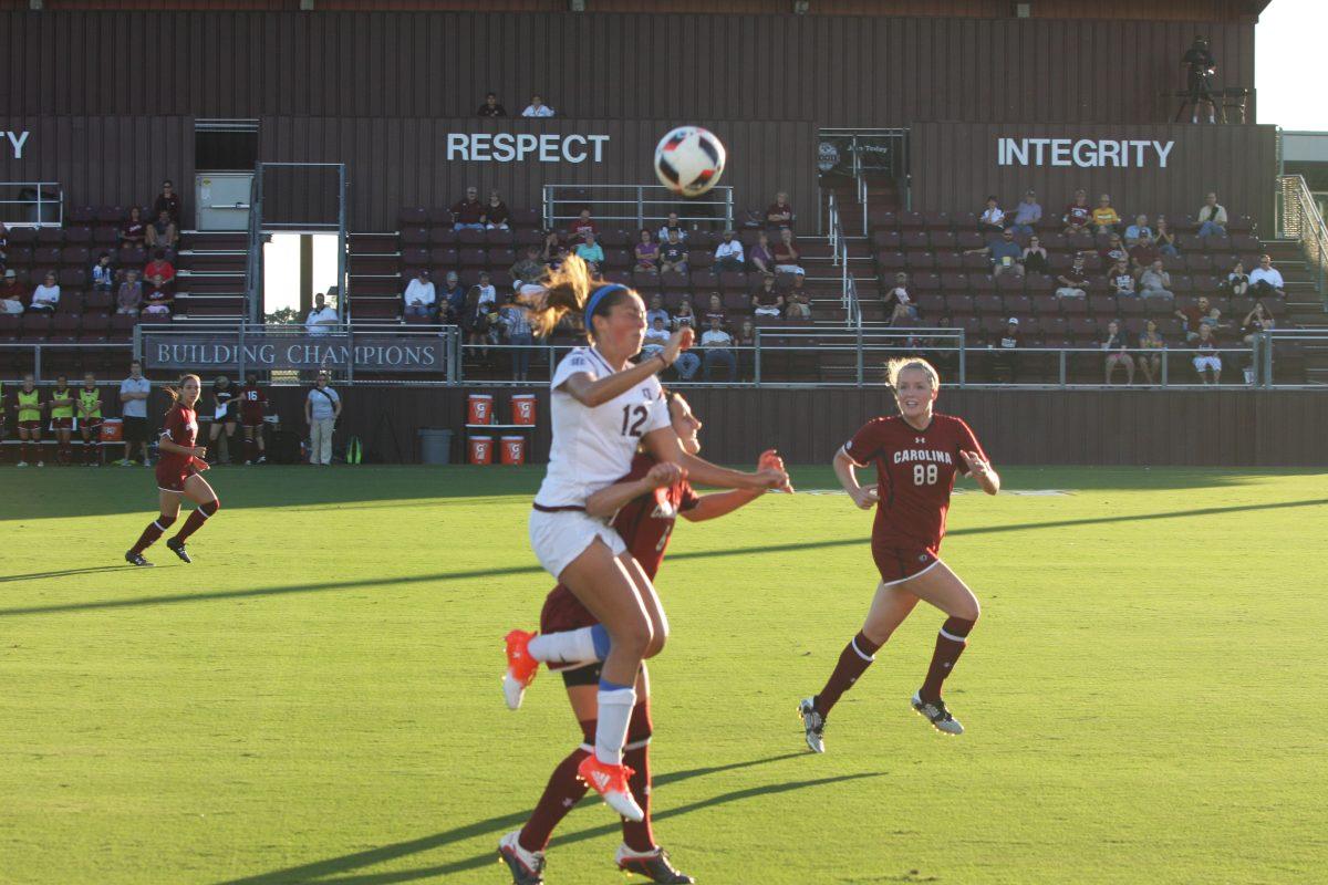 Junior forward Haley Pounds elevates for the header.