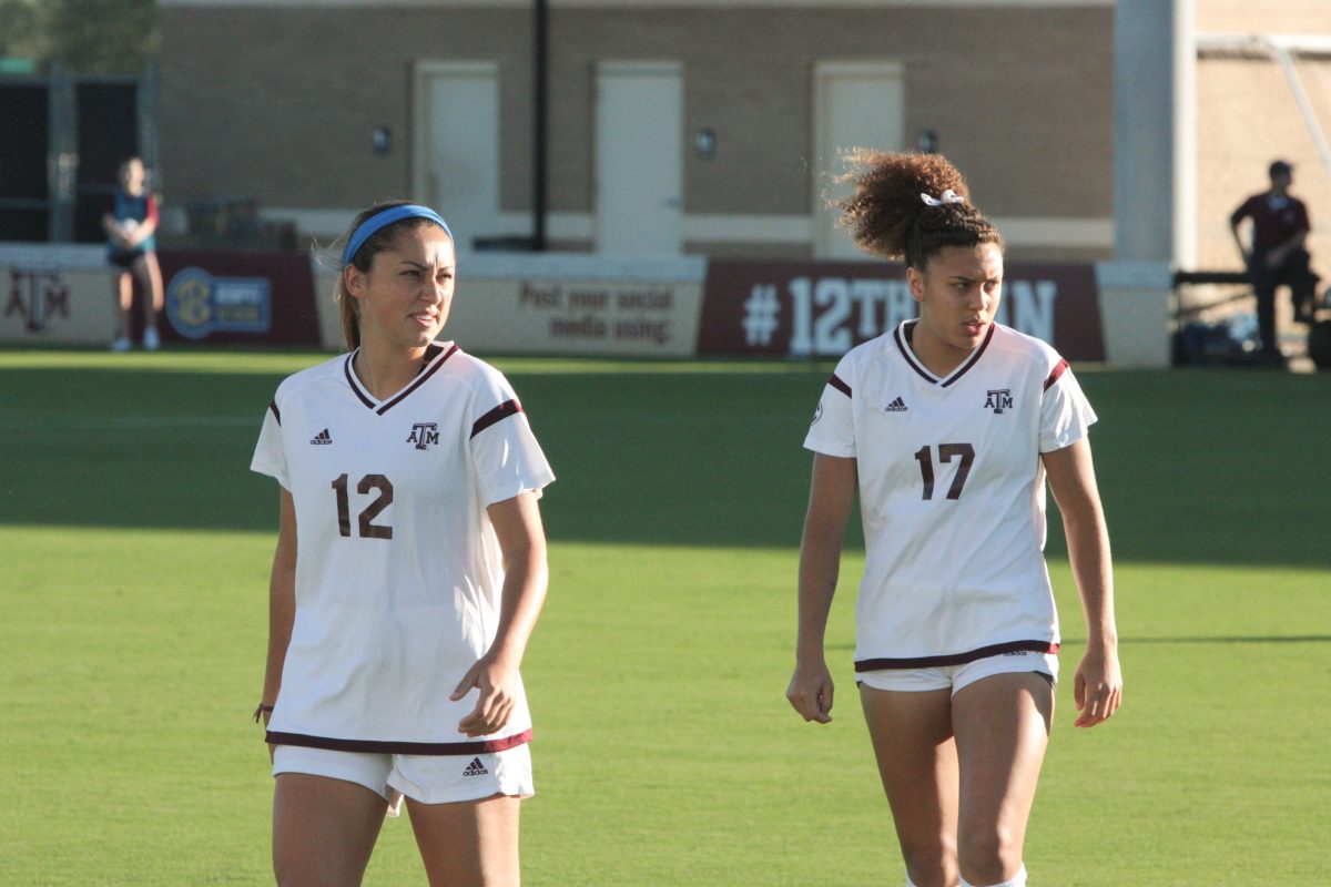 Junior forward Haley Pounds and Freshman forward Cienna Arrieta walk onto the field for the game.