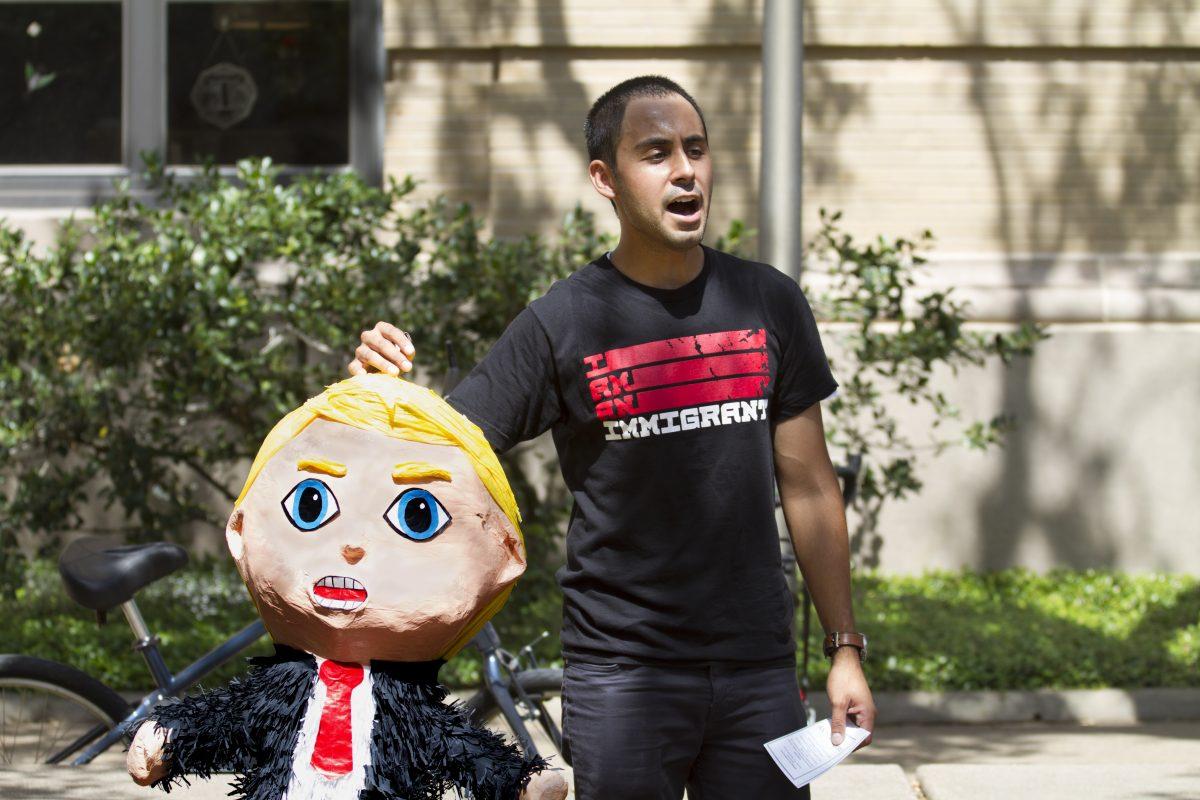 The Trump Pinata being held by Emilio Bernal