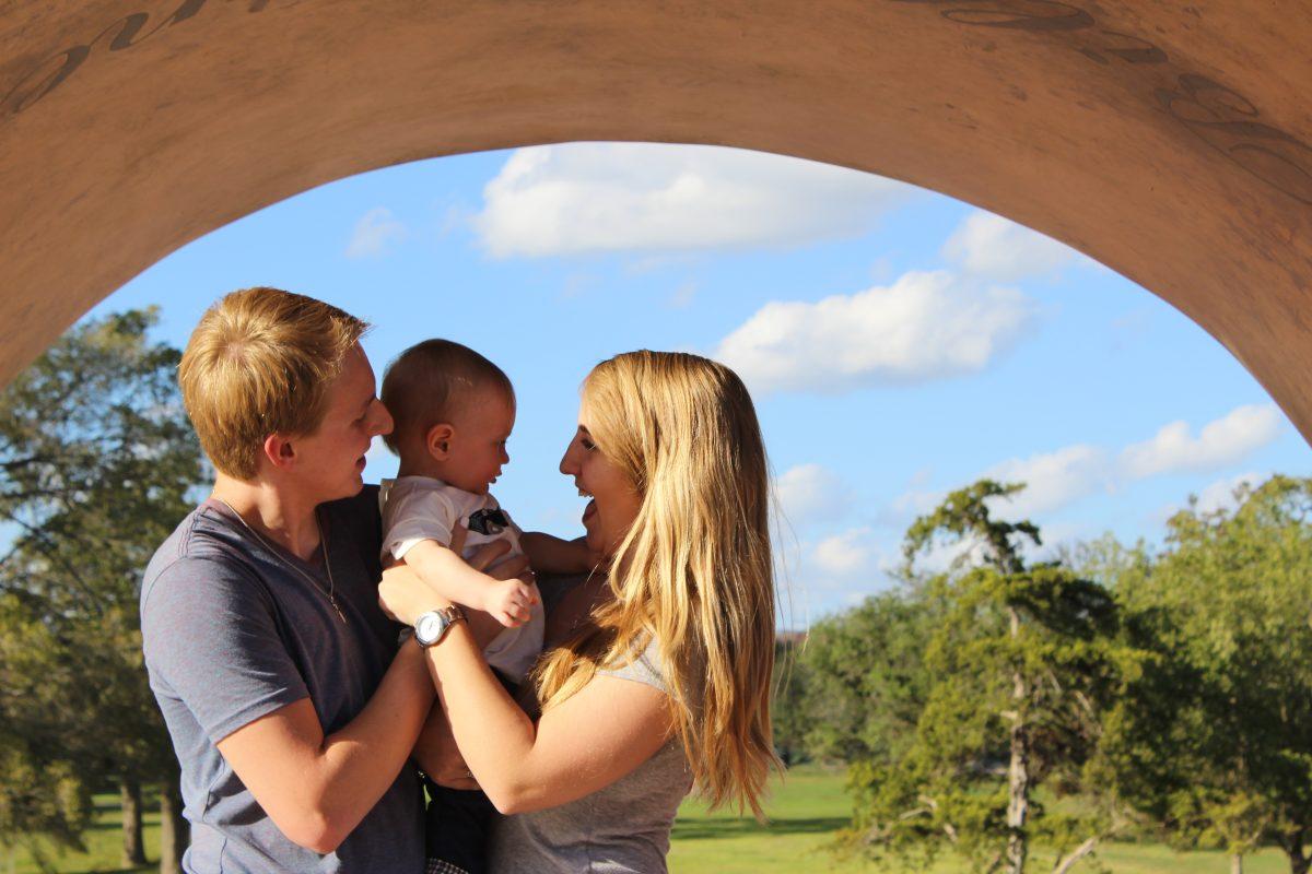 Bryce and Eric Golden, Sophomore Psychology major, enjoyed a day out with their son at the Aggie Ring Replica located at the Haynes Ring Plaza behind the Alumni Center.&#160;