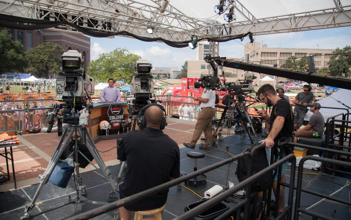 The ESPN Gameday film crew prepares to run a live broadcast during the College Gameday stage setup in Spence Park.