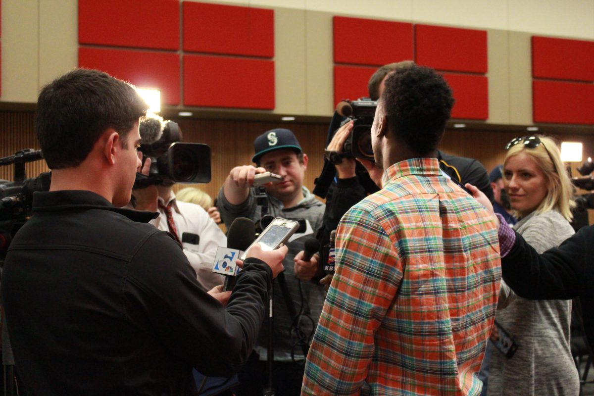 Reporters meet with Roshuund Paul in a breakout interview session.