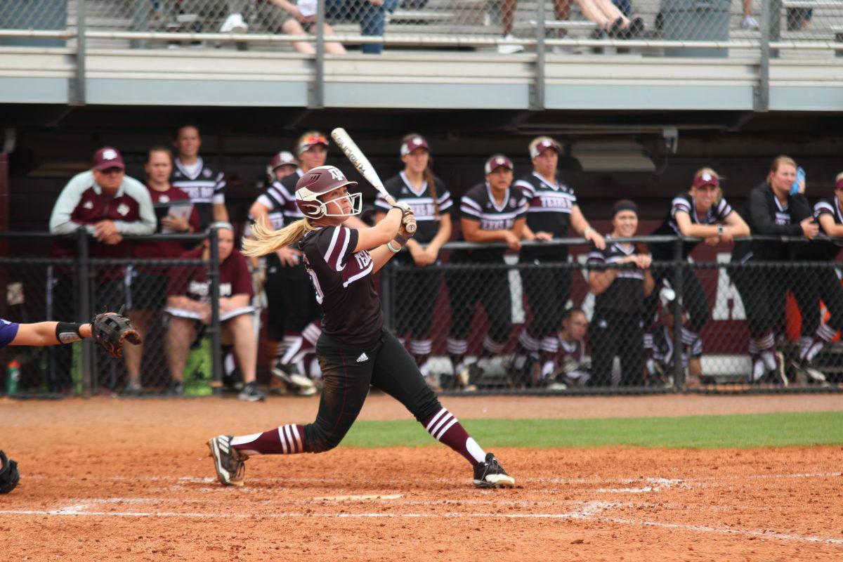 Sophomore+third+baseman+Riley+Sartain+watches+the+ball+as+she+follows+her+swing+through.+Sartain+had+four+at-bats%2C+three+hits%2C+and+one+RBI.